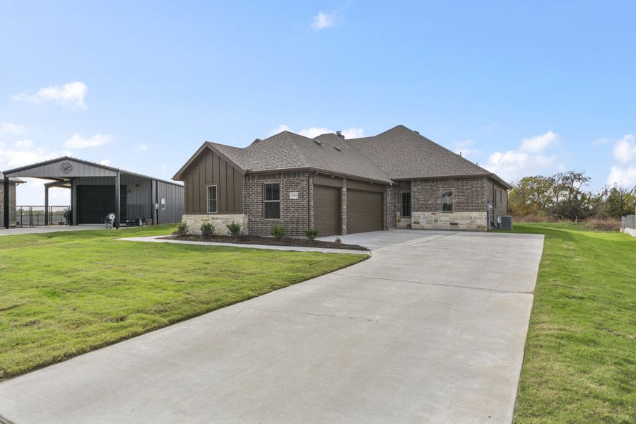 Representative exterior photo of a completed home built from the Austin II by Robbie Hale Homes in High Meadows Estates, Nevada, TX (Image 1). Representative exterior photo of a completed home built from the Austin II by Robbie Hale Homes in High Meadows Estates, Nevada, TX (Image 1).