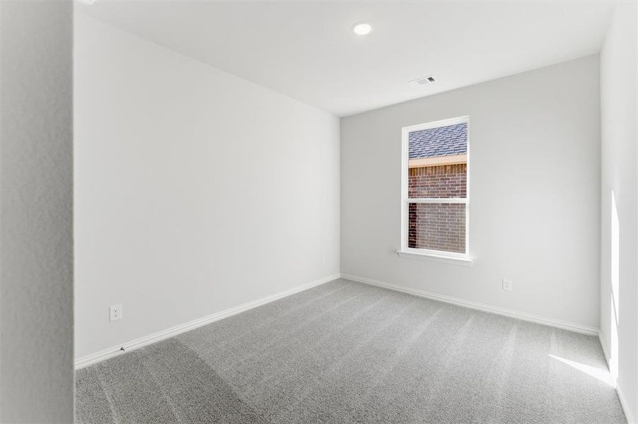 Unfurnished room with carpet flooring and recessed lighting