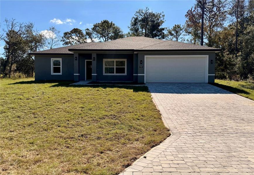 Front exterior of a new home in , Citrus Springs, FL, highlighting curb appeal (Image 2). Front exterior of a new home in , Citrus Springs, FL, highlighting curb appeal (Image 2).