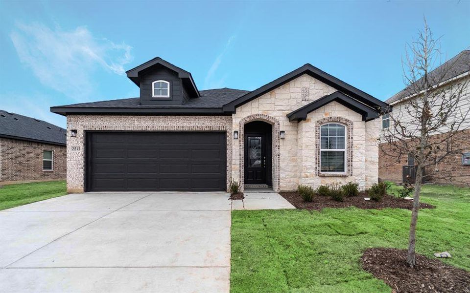 Front exterior of a new home in Pebblebrook, Sherman, TX, highlighting curb appeal (Image 1).
