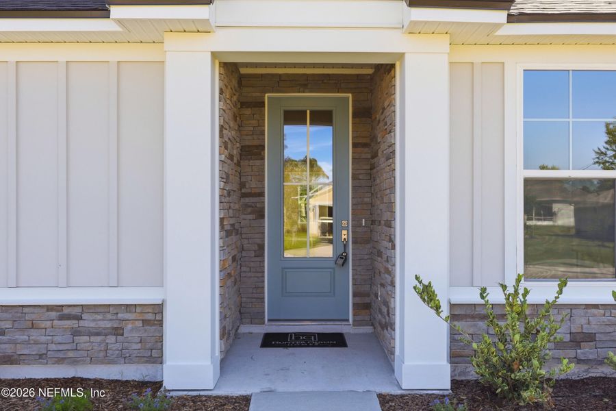 Exterior details and patio area of a home in Palm Coast Homes, Palm Coast (Image 3).