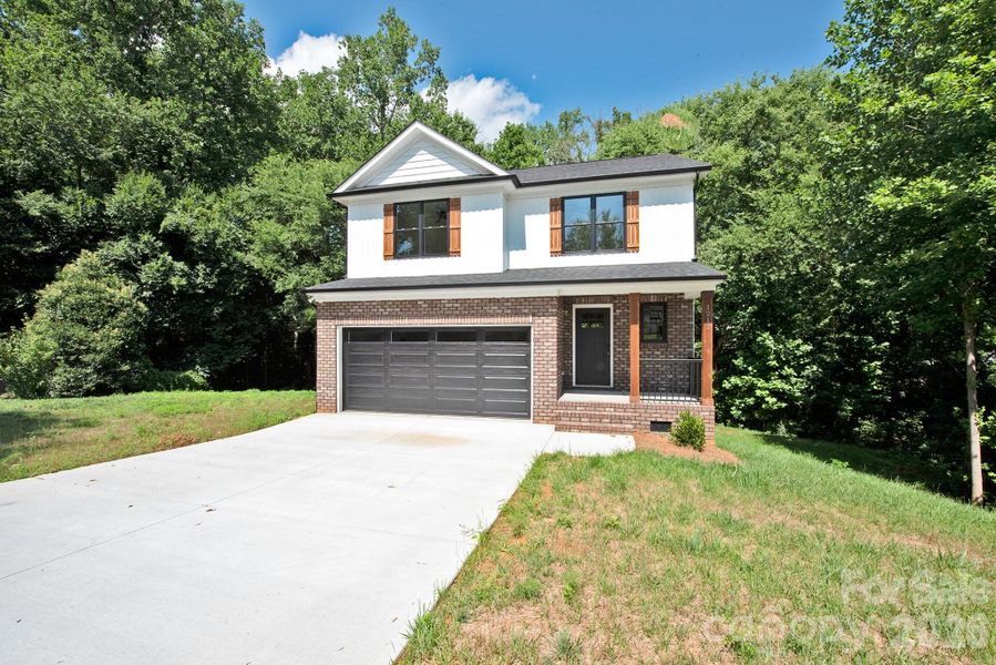 Front exterior of a new home in , Kannapolis, NC, highlighting curb appeal (Image 21). Front exterior of a new home in , Kannapolis, NC, highlighting curb appeal (Image 21).