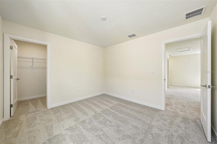 Spacious, unfurnished interior of a new home in Grasslands West, Lakeland (Image 32).