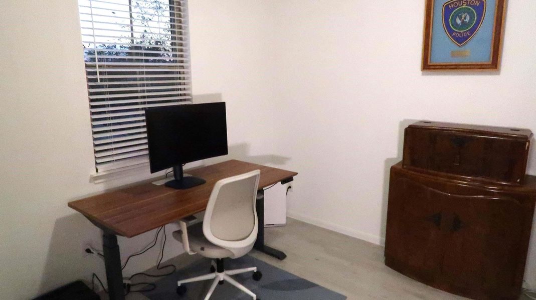 This room is set up as a home office featuring lots of natural light. This room is set up as a home office featuring lots of natural light.