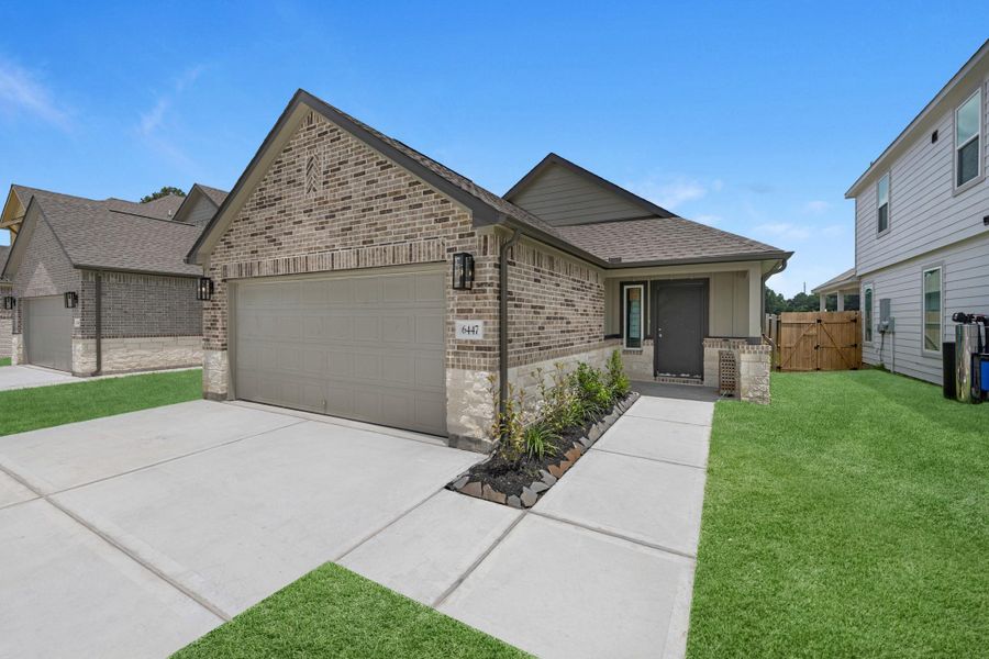 Front exterior of a new home in Cypresswood Landing, Humble, TX, highlighting curb appeal (Image 17). Front exterior of a new home in Cypresswood Landing, Humble, TX, highlighting curb appeal (Image 17).