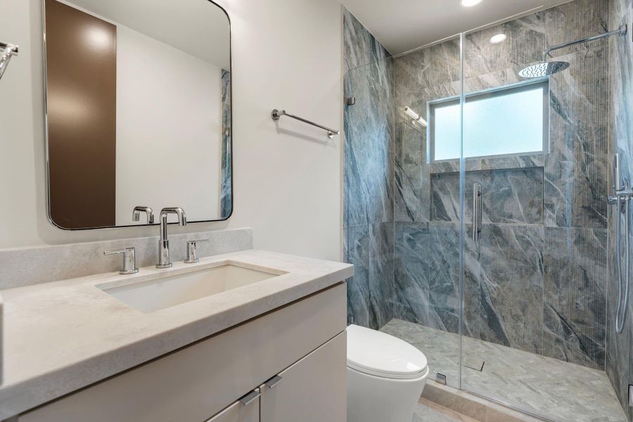 Full bathroom servicing Bedroom 4 and the sauna and wellness area. Full bathroom servicing Bedroom 4 and the sauna and wellness area.