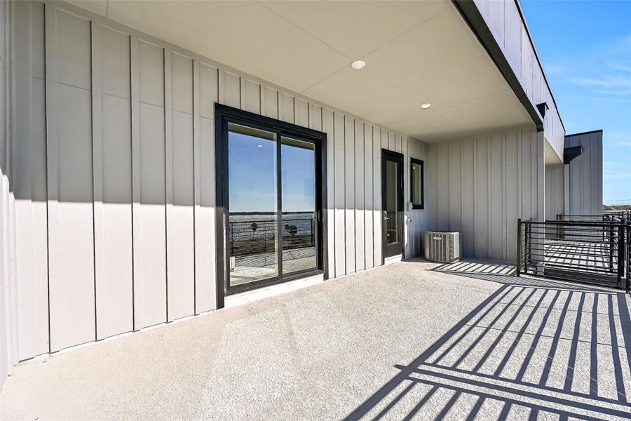 Exterior details and patio area of a home in Lago Pointe, Seabrook (Image 26).