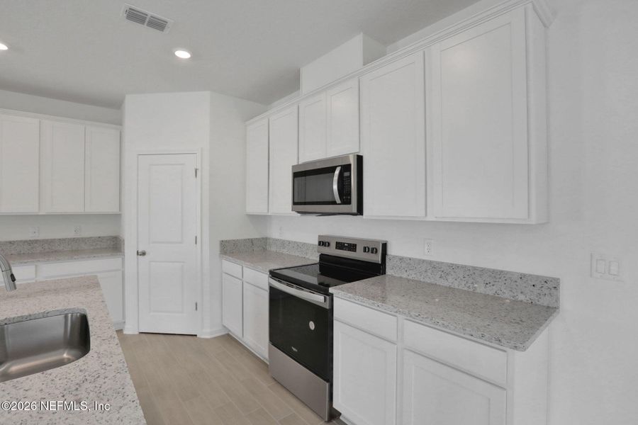 Furnished interior view inside a new home in Amberly, Green Cove Springs (Image 10).