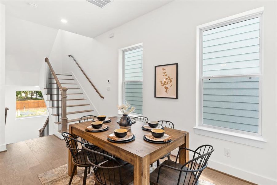 This dining area gives ample space and surrounded by natural light.