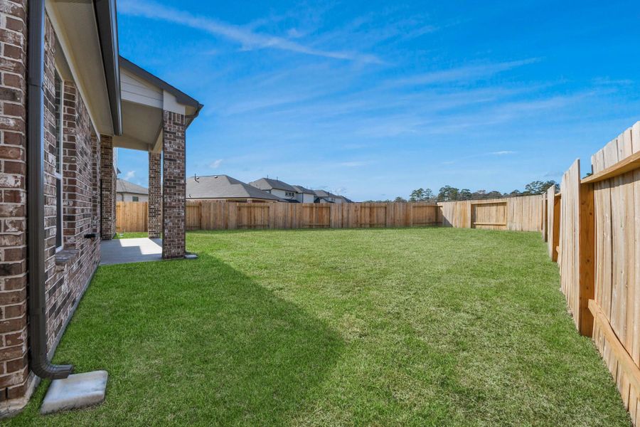 Backyard retreat, offering an abundance of space for kids to play and explore. The possibilities are endless in this outdoor haven, where the joy of open-air activities and family gatherings awaits.