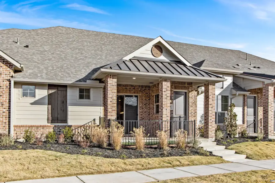 Front exterior of a new home in Woodbridge Villas, Wylie, TX, highlighting curb appeal (Image 2). Front exterior of a new home in Woodbridge Villas, Wylie, TX, highlighting curb appeal (Image 2).