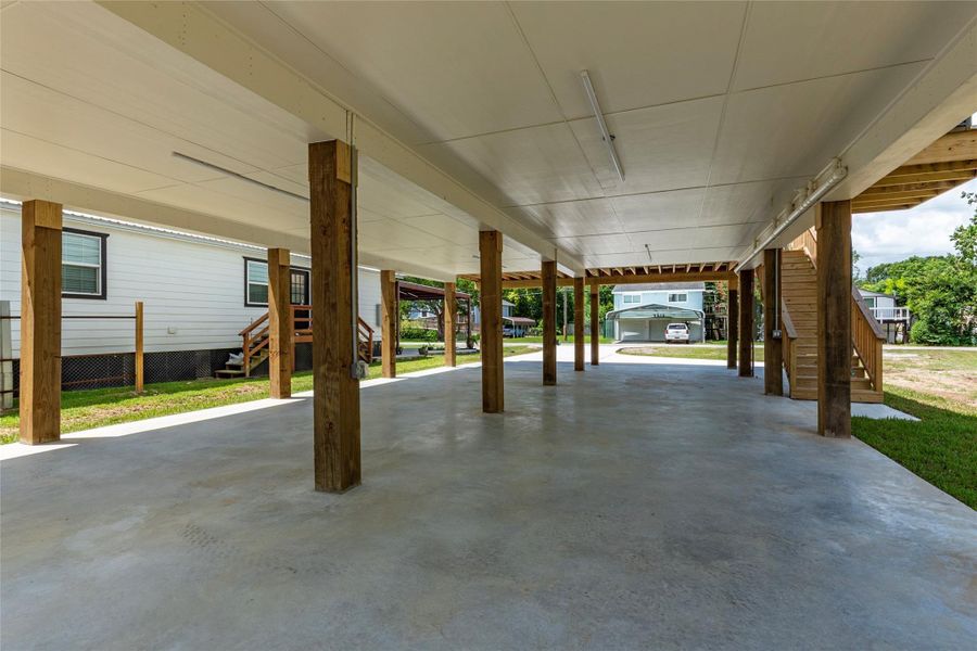 Extensive downstairs covered parking area that also offers great space for outdoor entertaining and more!