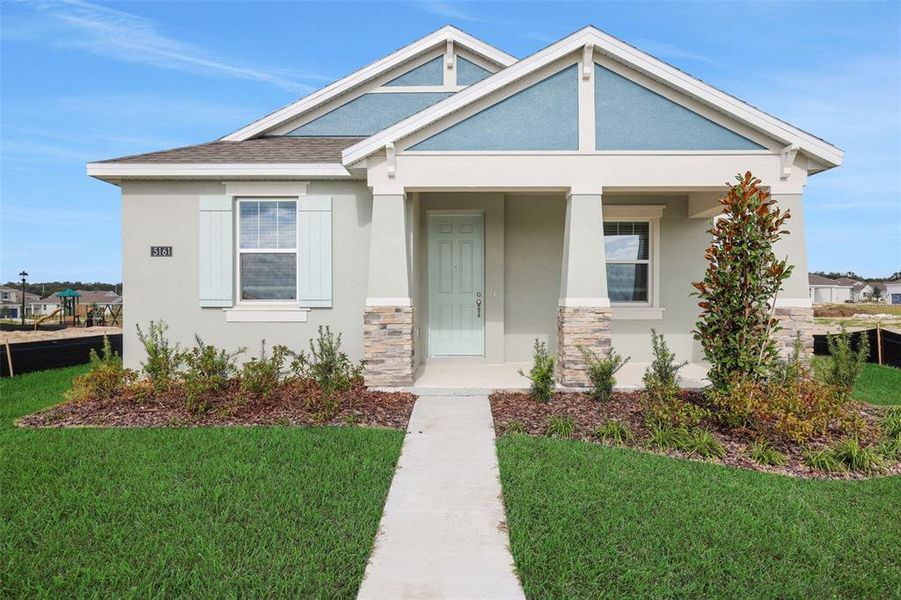 Front exterior of a new home in Crossroads at Kelly Park, Apopka, FL, highlighting curb appeal (Image 20).