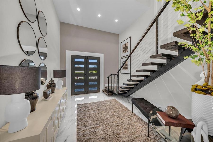 Opt for the stairs or elevator in this one-of-a kind, custom home.