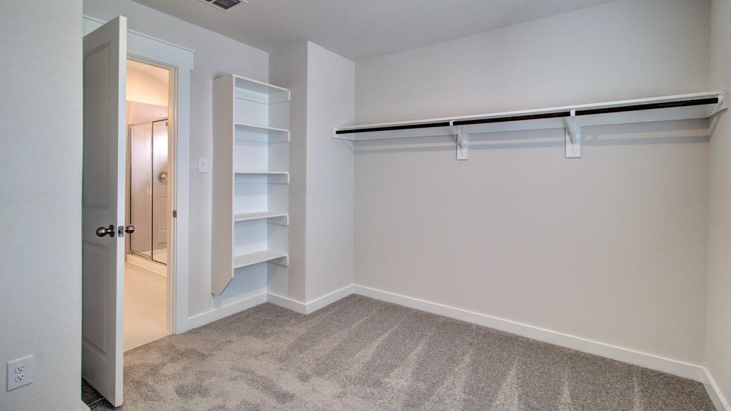 Representative furnished interior of a home built from the Majestic by Brightland Homes in Sunterra, Katy (Image 14).