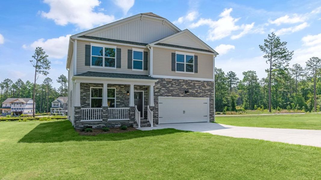 Representative exterior photo of a completed home built from the WILMINGTON by D.R. Horton in Gretchen Pines, West End, NC (Image 21).
