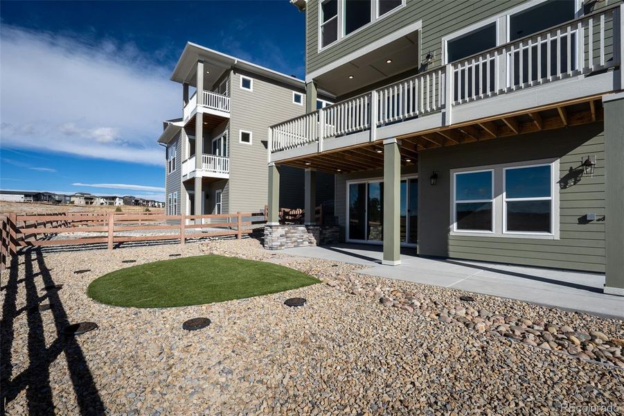 Exterior details and patio area of a home in Revel Crossing at Wolf Ranch - The Panorama Collection, Colorado Springs (Image 25).