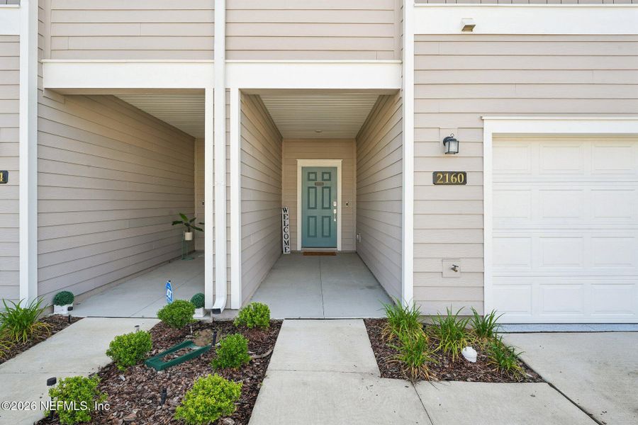 Exterior details and patio area of a home in Longbay Townhomes, Middleburg (Image 4).