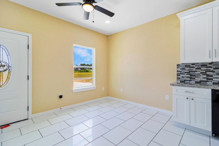 Little water view, nice glass design on door and a cozy breakfast table area. Little water view, nice glass design on door and a cozy breakfast table area.