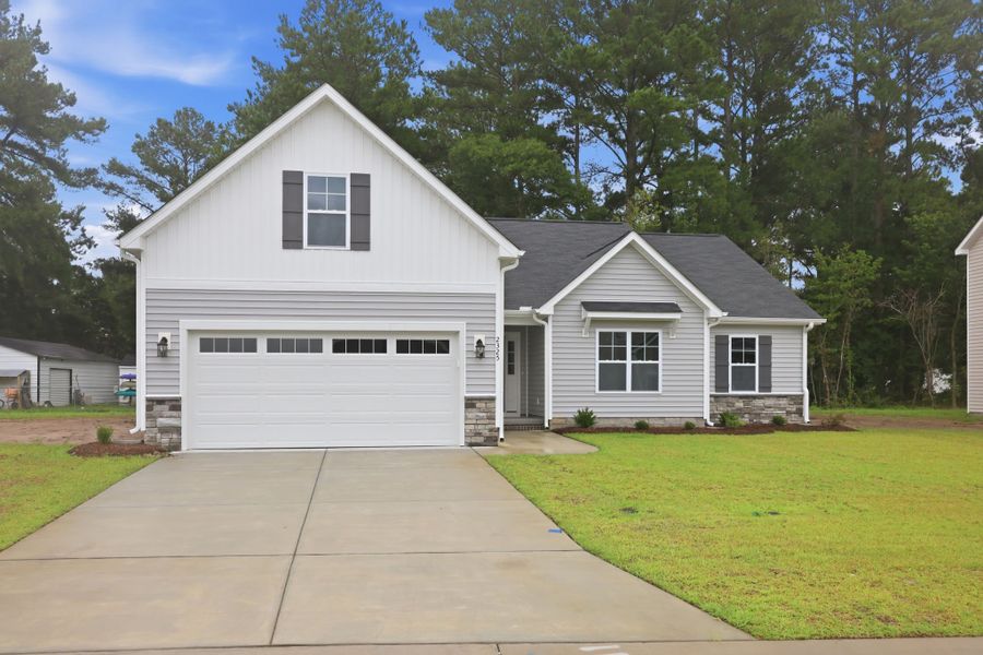 Front exterior of a new home in Davenport Farms, Winterville, NC, highlighting curb appeal (Image 22). Front exterior of a new home in Davenport Farms, Winterville, NC, highlighting curb appeal (Image 22).