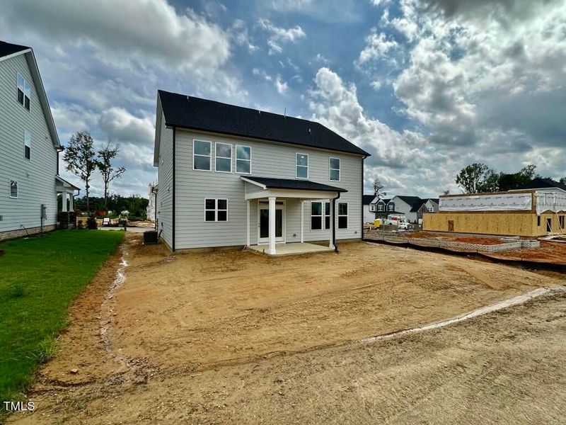Front exterior of a new home in Glenmere, Knightdale, NC, highlighting curb appeal (Image 104). Front exterior of a new home in Glenmere, Knightdale, NC, highlighting curb appeal (Image 104).