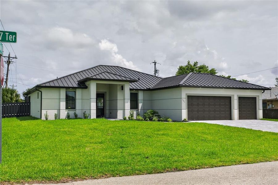 Front exterior of a new home in , Cape Coral, FL, highlighting curb appeal (Image 2). Front exterior of a new home in , Cape Coral, FL, highlighting curb appeal (Image 2).
