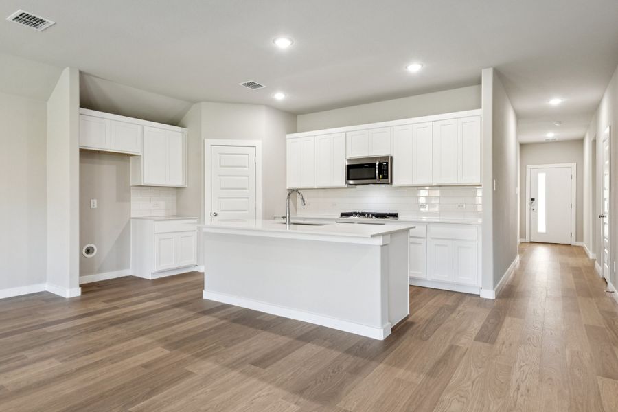 Kitchen in the Emmy II home plan by Trophy Signature Homes - REPRESENTATIVE PHOTO Kitchen in the Emmy II home plan by Trophy Signature Homes - REPRESENTATIVE PHOTO
