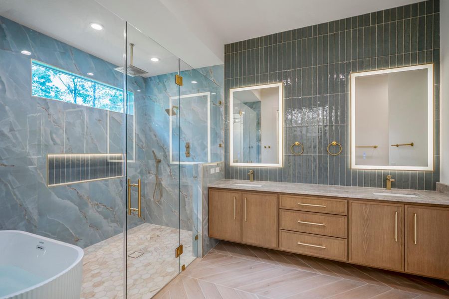 Beautiful view of stand alone tub and duel shower system with glass enclosure makes evening and weekend baths a special treat to look forward to. Beautiful view of stand alone tub and duel shower system with glass enclosure makes evening and weekend baths a special treat to look forward to.