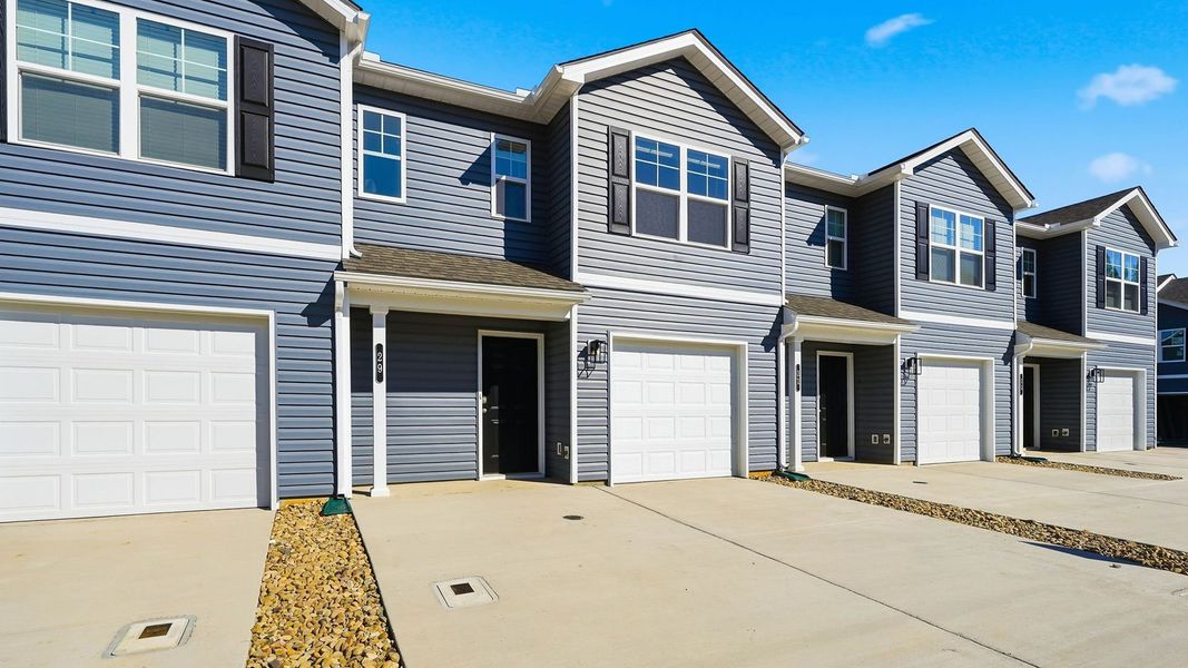 Front exterior of a new home in Warren's Way Townhomes, Jonesborough, TN, highlighting curb appeal (Image 2). Front exterior of a new home in Warren's Way Townhomes, Jonesborough, TN, highlighting curb appeal (Image 2).