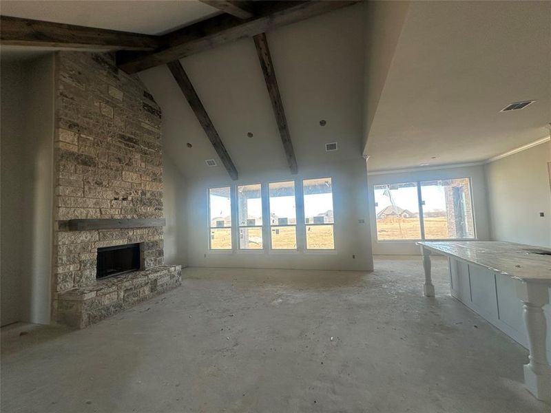 Living with fireplace and stained beams
