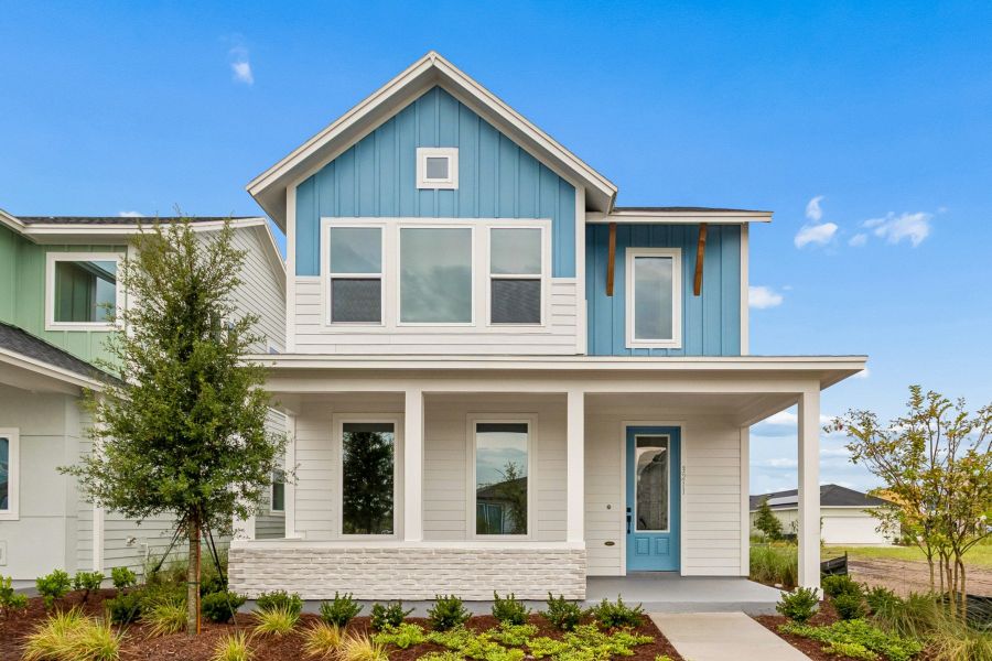 Front exterior of a new home in Weslyn Park in Sunbridge 34', St. Cloud, FL, highlighting curb appeal (Image 2). Front exterior of a new home in Weslyn Park in Sunbridge 34', St. Cloud, FL, highlighting curb appeal (Image 2).