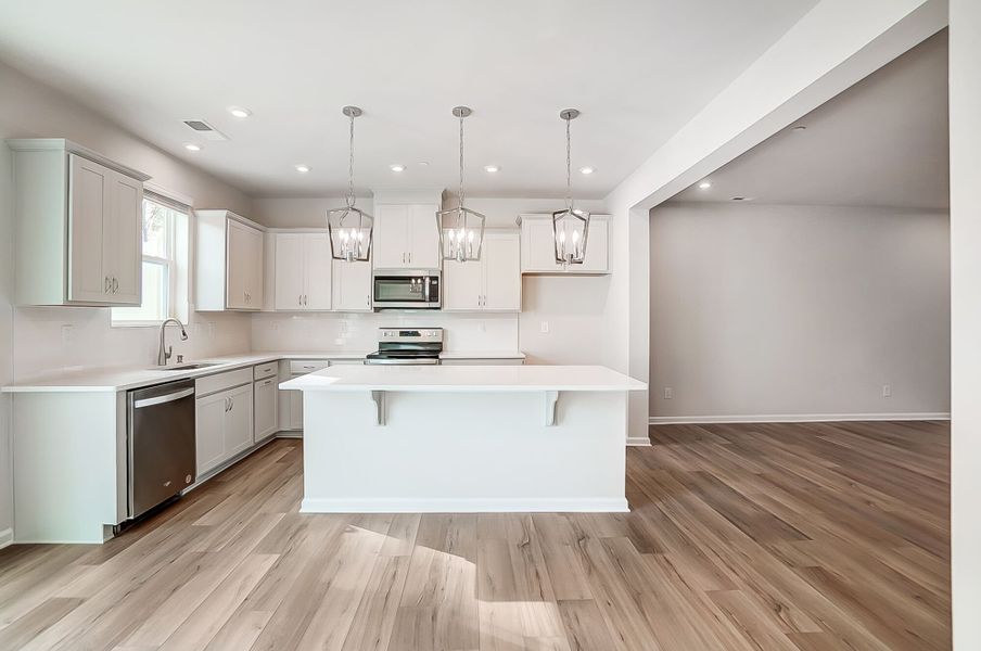 Kitchen with island breakfast bar