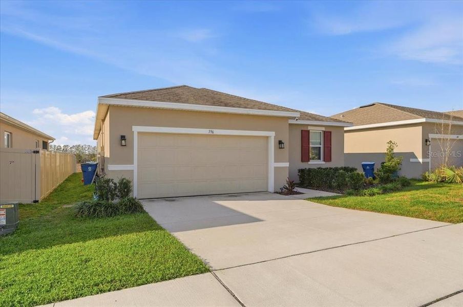 Front exterior of a new home in , Lake Wales, FL, highlighting curb appeal (Image 22). Front exterior of a new home in , Lake Wales, FL, highlighting curb appeal (Image 22).