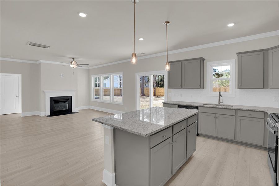 This open concept space features a kitchen island This open concept space features a kitchen island