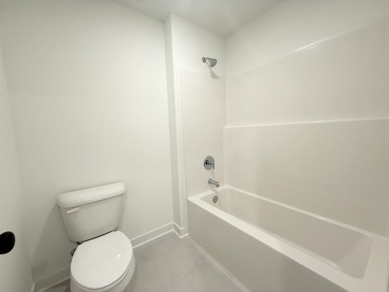 Full bath with toilet and bathtub / shower combination