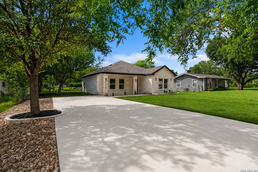 Front exterior of a new home in , Castroville, TX, highlighting curb appeal (Image 2). Front exterior of a new home in , Castroville, TX, highlighting curb appeal (Image 2).