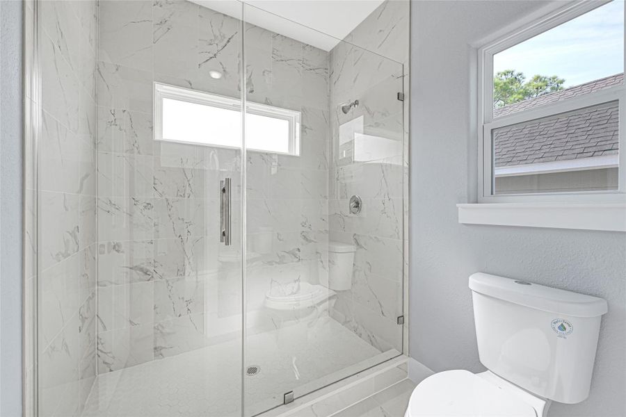 hall bath on the second floor with frameless shower door, dual flash toilets in all 4 bathrooms hall bath on the second floor with frameless shower door, dual flash toilets in all 4 bathrooms