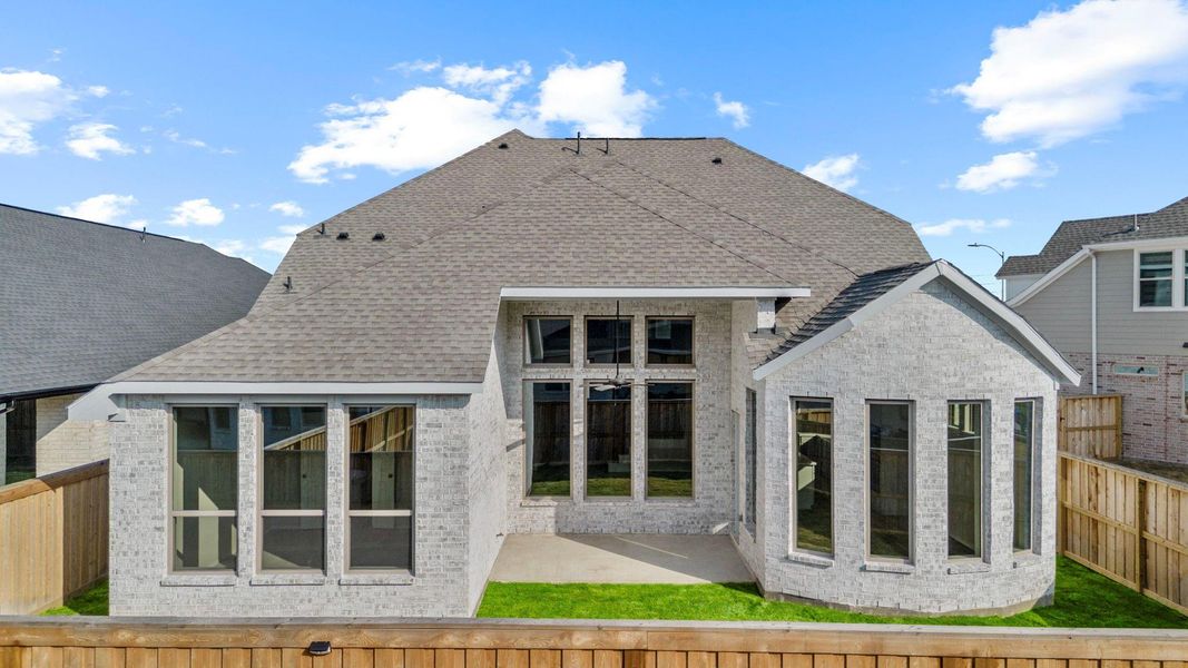 Exterior details and patio area of a home in Dunham Pointe 50', Cypress (Image 3).
