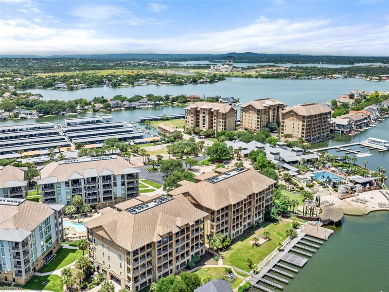 Waterfront condominium community featuring multiple buildings with private balconies Waterfront condominium community featuring multiple buildings with private balconies