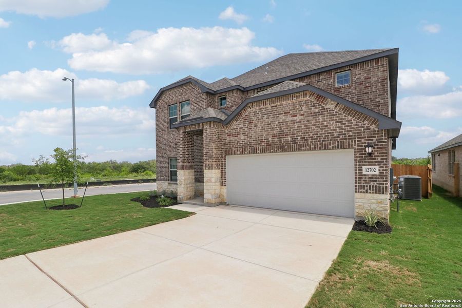 Front exterior of a new home in Arcadia Ridge - Classic Series, San Antonio, TX, highlighting curb appeal (Image 22).