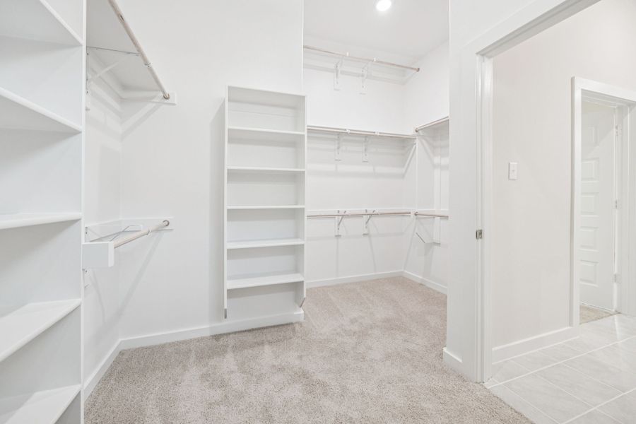 Primary Closet in the Claret home plan by Trophy Signature Homes – REPRESENTATIVE PHOTO
