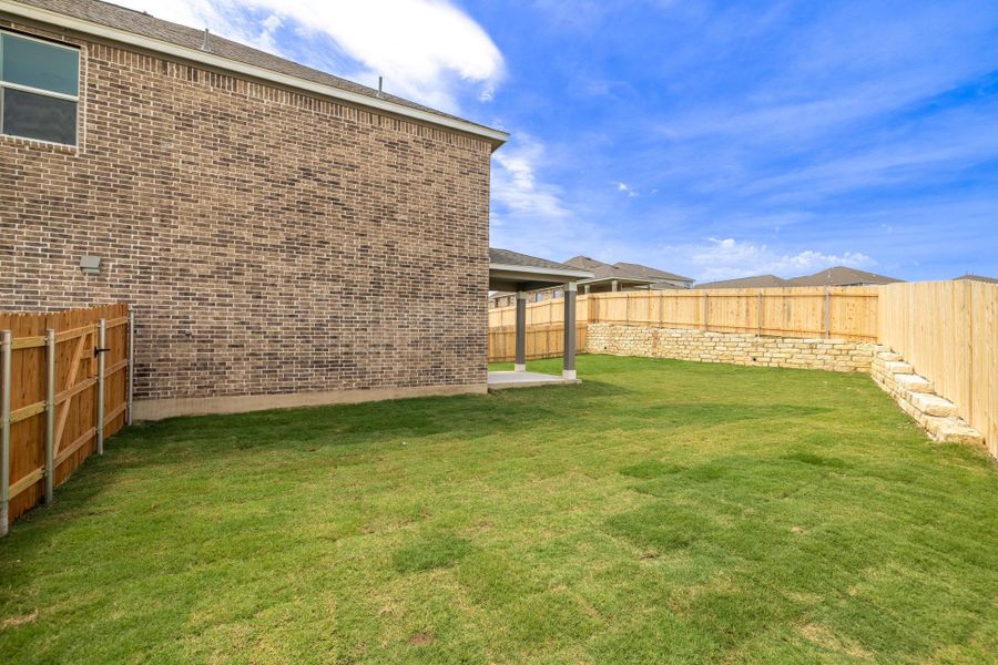 Front exterior of a new home in Salerno - Heritage Collection, Round Rock, TX, highlighting curb appeal (Image 20). Front exterior of a new home in Salerno - Heritage Collection, Round Rock, TX, highlighting curb appeal (Image 20).