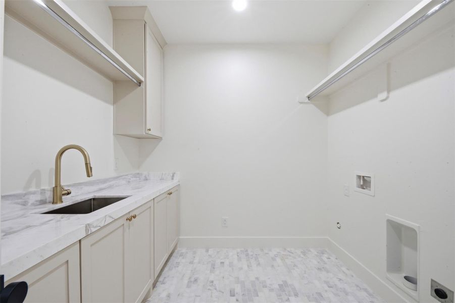 Spacious Laundry Room with Wash Sink and Drying Racks