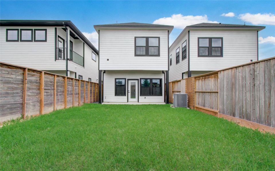 Spacious yard! High wooden fences for privacy.