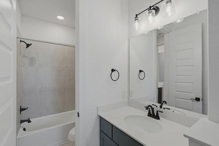 Representative furnished interior of a home built from the Kingston by Chesmar Homes in Prominence 60's, San Antonio (Image 37).
