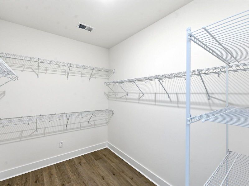 Spacious, unfurnished interior of a new home in The Coves at Lakes of Cane Bay II, Summerville (Image 30).