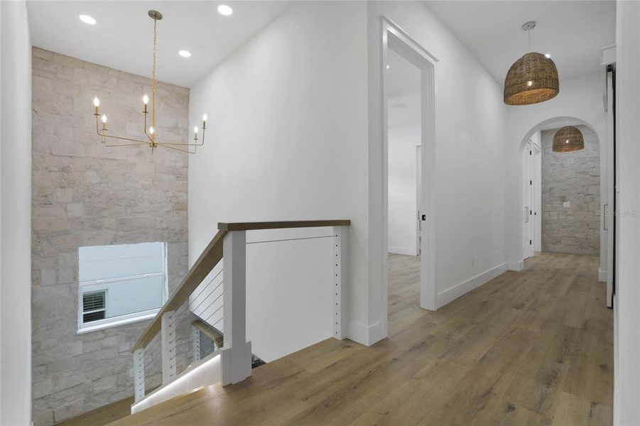 Second floor arched entry to east bedrooms and bath.