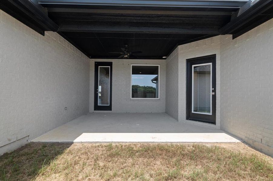 Back of property featuring a patio area