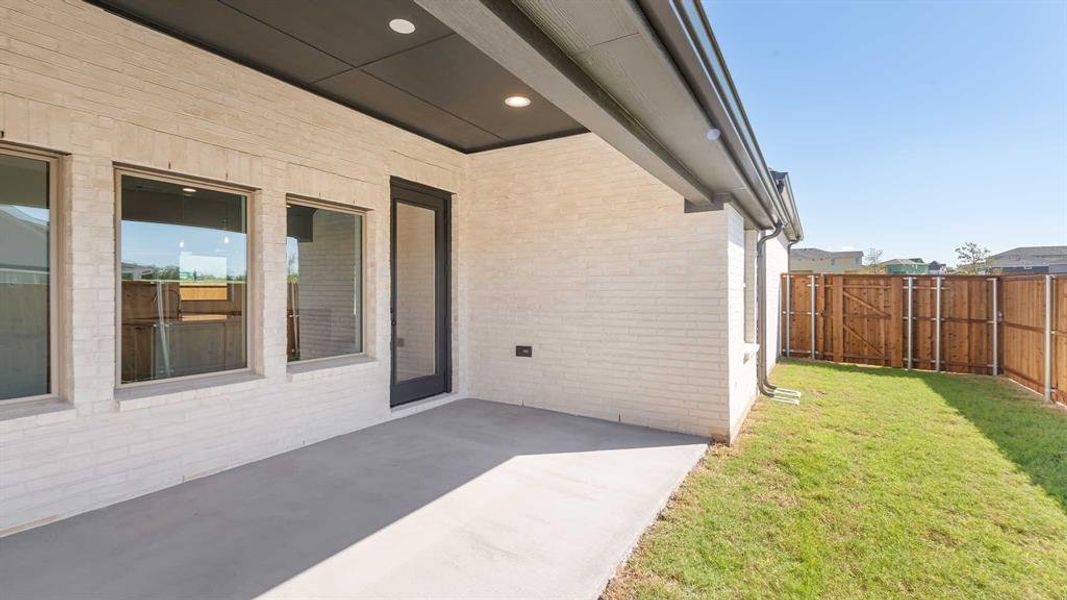 Exterior details and patio area of a home in The Heights At Uptown Celina 45', Celina (Image 2). Exterior details and patio area of a home in The Heights At Uptown Celina 45', Celina (Image 2).