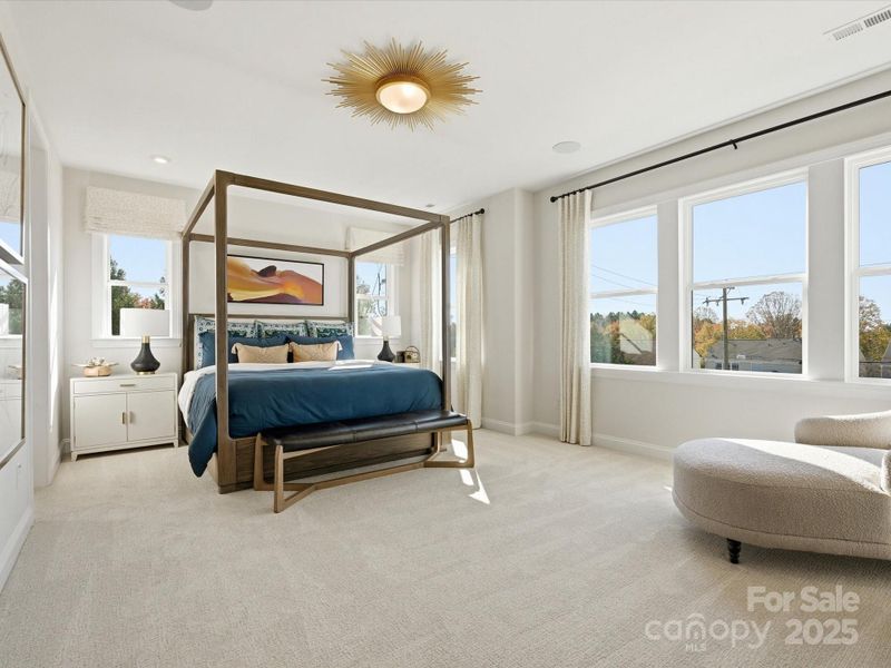 Primary Suite Bathed in Light and Featuring 9' Ceilings. *Model Photos | Actual Finishes, Structural Selections, and Orientation May Vary. Primary Suite Bathed in Light and Featuring 9' Ceilings. *Model Photos | Actual Finishes, Structural Selections, and Orientation May Vary.